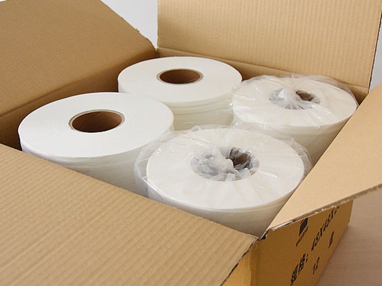 Commercial jumbo toilet paper roll detail showing high-capacity virgin pulp construction - Top Source Paper