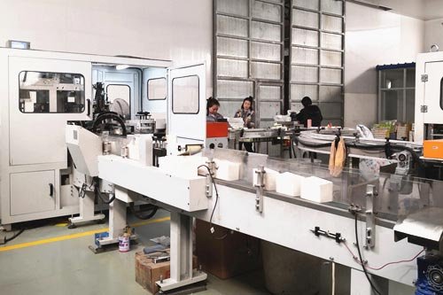 Napkin folding and converting line running at production speed