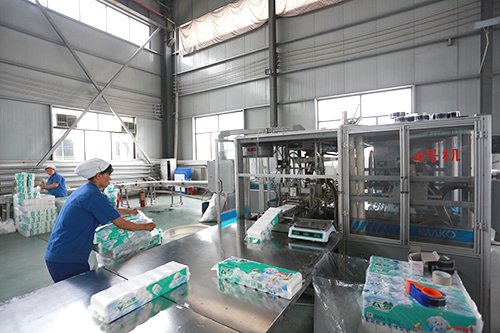 High-speed tissue rewinding and printing line at Top Source Paper
