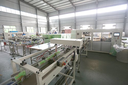 Embossing and ply-combining station for multifold hand towels